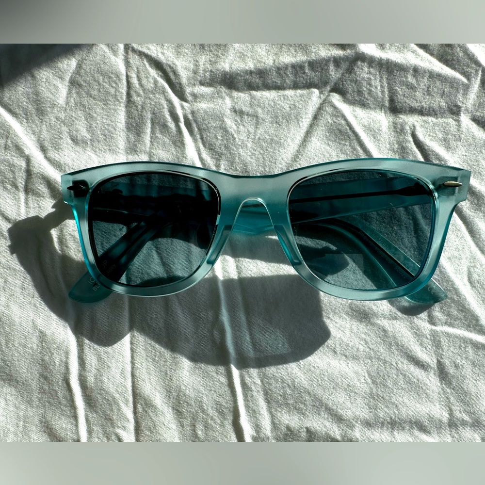 Ray-Ban  Original Wayfarer, transparent blue frame.